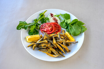 Fried Anchovies (Turkish Name: Hamsi Tava) .Hamsi, istavrit, sardalya tava. Balik kizartma. Izgara cipura levrek, palamut  yesil salata.