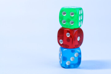 Colorful dices on a white background, closeup of photo