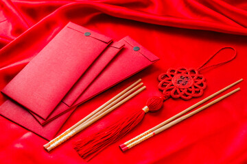 a red envelope with a red ta tat and a red tat