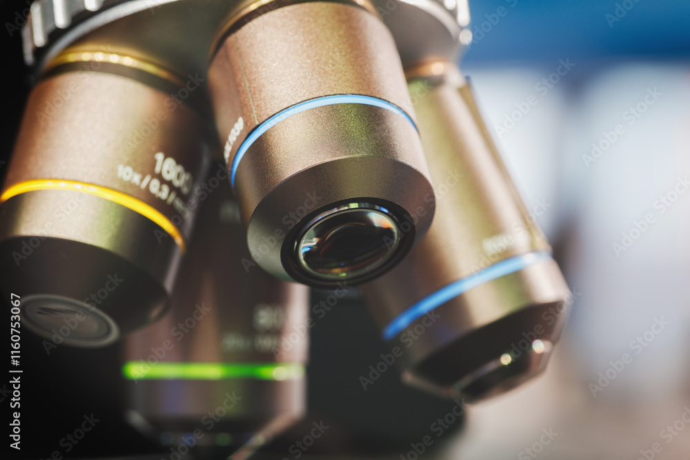 Poster close-up of microscope lenses in a laboratory