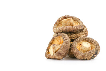 Dried shiitake mushrooms on white background