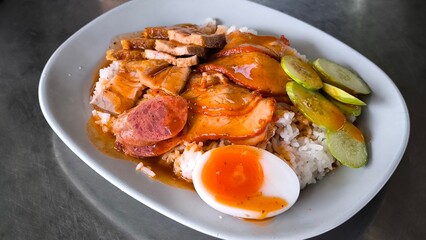 Red pork and crispy pork on rice, food in Thailand