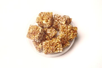 Jipang or berondong is indonesian traditional snack. Made from rice, corn coated with sweet caramel. Isolated white background