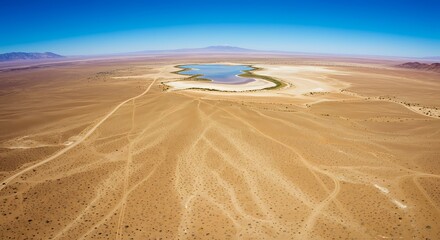 Aerial view of a dry desert landscape.  Arid playa lake nestled amidst mountains.