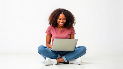 Fototapeta premium Happy young African American woman student sitting isolated at white background using laptop computer advertising elearning course, online education webinars, internet services. Vertical photo.
