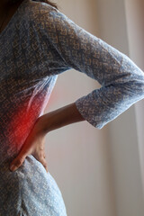 Illustration of young woman with back pain.