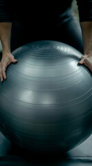 Person Holding a Large Stability Ball for Fitness, Exercise, and Balance Training. Improves Core Strength.