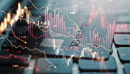Stock market decline with red graph lines and financial data overlayed on a blurry keyboard background.