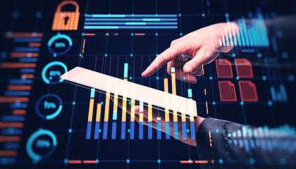 Interactive digital interface with financial graphs and charts on tablet screen in business setting.