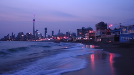 City skyline at twilight, beach waves, reflections.