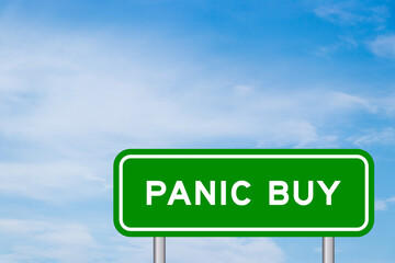 Green color transportation sign with word panic buy on blue sky with white cloud background