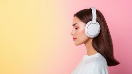 Young woman enjoying music with headphones against gradient background