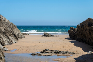 Beautiful sand beach in north Spain with big rocks