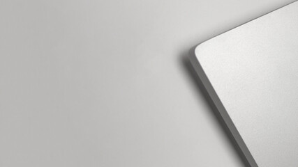 A white laptop is on a white background. The laptop is the main focus of the image. The background is plain and simple, with no other objects or distractions. Concept of focus and productivity