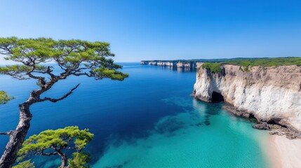 Obraz premium Serene coastal landscape with cliffs and clear blue waters.