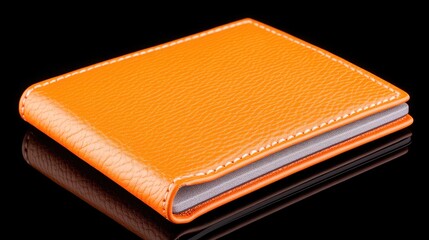 Bright Orange Leather Wallet on Glossy Black Surface, Modern Fashion Accessory for Stylish Individuals, Versatile Organizer for Cards and Cash