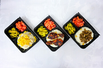 Delicious meat kebab with fresh vegetable salad served with variety of Turkish dishes and appetizers. Top view of assorted Turkish food and meze, tasty and healthy Mediterranean cuisine.