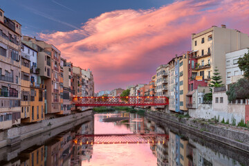 View of Girona Cathedral, Red Bridge and colorful buildings along the Onyar River in Girona, Spain