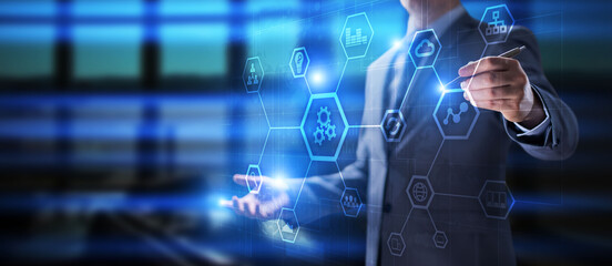 Mixed media. Business Organisational structure on virtual screen with process icons.