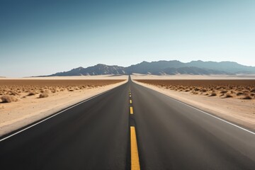 there is a long road that is in the middle of the desert