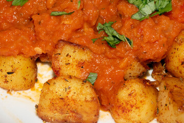 Close up of Porato Tapas Roasted Tomato auce Bravas