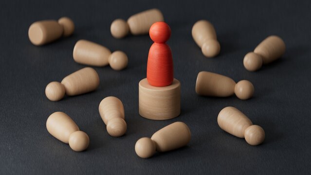 3D illustration of pawns fallen on floor and a red one protected by a Wooden round table. Individual protection and insurance concept.3D rendering on black background.