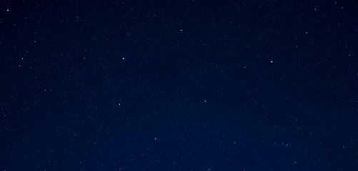 Fototapeta premium The night sky has shooting a star and the Milky Way in the background.