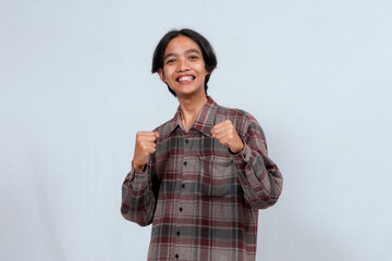 Young Asian man looking camera showing enthusiastic expression