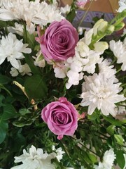 A luxurious bouquet of fresh flowers in a crystal vase on the holiday table and an elegant portion in the restaurant.