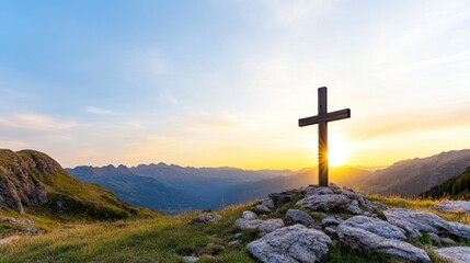 A wooden cross stands on a hillside at sunset, symbolizing faith.