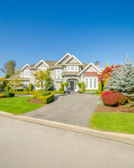 Two story luxury house with beautiful summer  landscape in Vancouver, Canada, North America. Day time on June 2024.