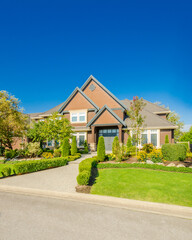 Two story luxury house with beautiful summer  landscape in Vancouver, Canada, North America. Day time on June 2024.
