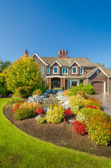 Two story luxury house with beautiful summer  landscape in Vancouver, Canada, North America. Day time on June 2024.