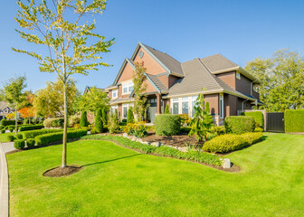 Two story luxury house with beautiful summer  landscape in Vancouver, Canada, North America. Day time on June 2024.