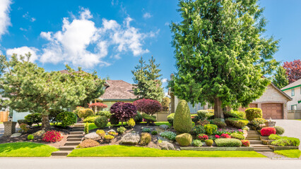 Two story luxury house with beautiful summer  landscape in Vancouver, Canada, North America. Day time on June 2024.