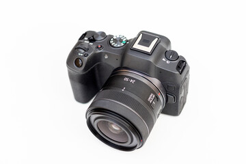 Fototapeta premium Interchangeable lens digital professional camera for photography and videography on white isolated background