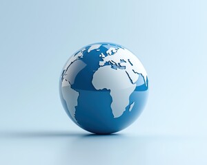 Fototapeta premium A globe representing the Earth on a soft blue background, symbolizing sustainability.