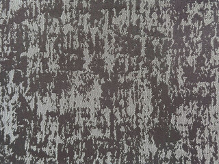 Close up of silk fabric in random washed and dirt pattern. In dark grey color. Suitable for upholstery, carpet, rug, and drapery. Seamless background texture.