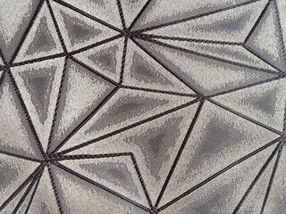 Close up of grey and black fabric in abstract random geometric star pattern. Suitable for upholstery, carpet, rug, and curtain. Seamless geometric star shape background texture.