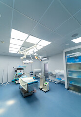 High-tech surgical room. Bright, clean surgical room features advanced medical equipment, surgical table, and ample lighting for procedures.