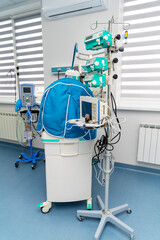 Healthcare equipment setup. Medical equipment in the healthcare room features advanced tech and essential devices for patient care.