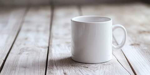 A plain, white mug rests on a white wooden table, providing ample opportunity for personalized designs and customization ideas.