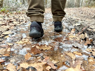 ice frost frozen puddle man walking on ice