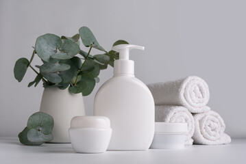 White bottles of lotion and cream