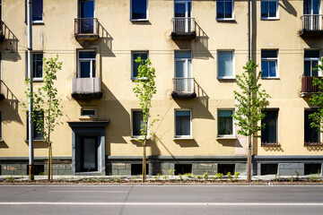 Soviet era architecture style of living district in Vilnius, Lithuania. Post-soviet urban architecture. Wall with windows and balconies.