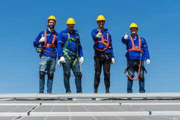 Group of professional solar engineer men team working on industrial roof