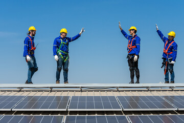 Group of solar technician teammates working together on solar roof installation