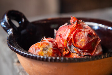 Tomatoes roasted on a Mexican comal to prepare a red mole in the Oaxaca region.