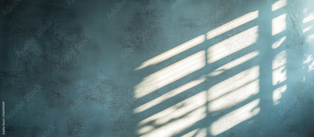 Poster light and shadow play from blinds creating a textured wall background with ample space for text and 