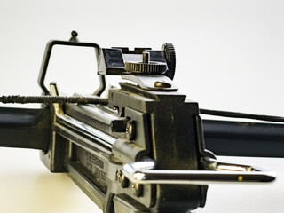 Sight of a Black training crossbow on a white background. Close-up.
